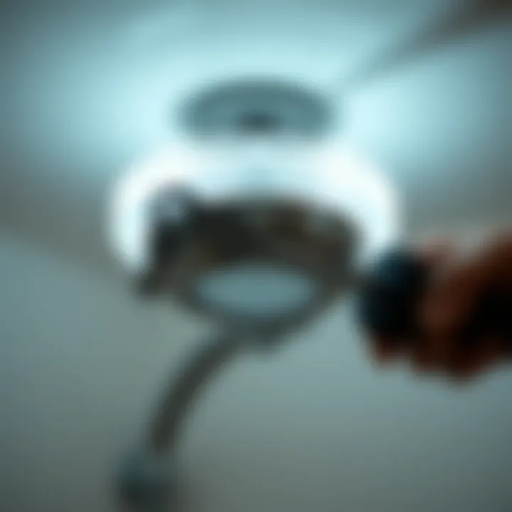 Maintenance of an overhead shower light fixture with tools