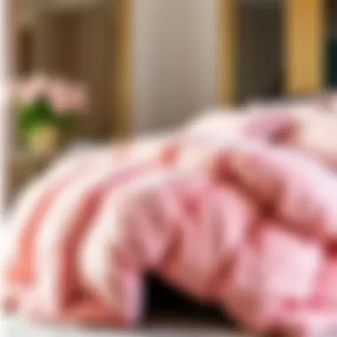 Luxurious pink furry comforter draped elegantly over a bed