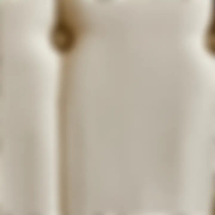 Close-up of the fabric texture on a beige upholstered queen bed frame.