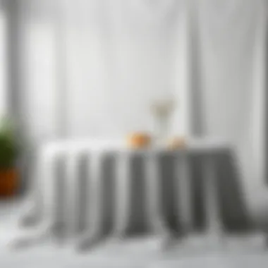 Light gray flat sheets creatively used as a table cover